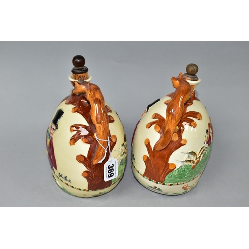 369 - TWO CROWN DEVON JOHN PEEL MUSICAL FLASKS, with wooden stoppers, relief moulded scenes and handles in... 