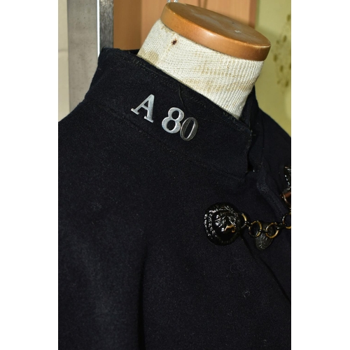 385 - A VINTAGE POLICEMANS CAPE WITH BIRMINGHAM POLICE BUTTONS, metal lion mask fastener, one number missi... 