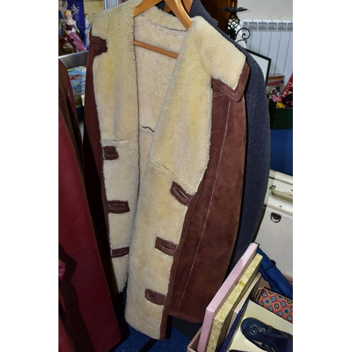 395 - A GROUP OF VINTAGE CLOTHING comprising a ladies blue leather mid length jacket, a men's oxblood leat... 