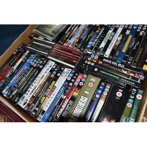 401 - FOUR BOXES OF L.P RECORDS, DVDS AND TREEN, to include over sixty DVDs including Skyfall, Casino Roya... 