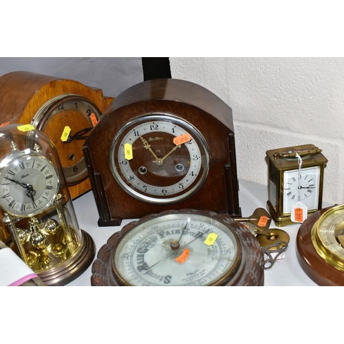 409 - FIVE CLOCKS AND TWO BAROMETERS, comprising a Weston Super quartz wall clock, Hermle quartz anniversa... 