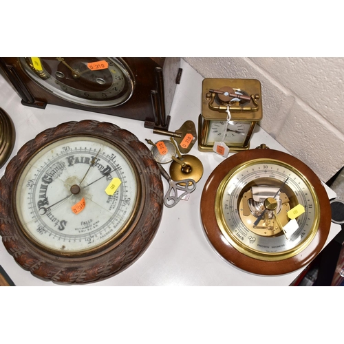 409 - FIVE CLOCKS AND TWO BAROMETERS, comprising a Weston Super quartz wall clock, Hermle quartz anniversa... 