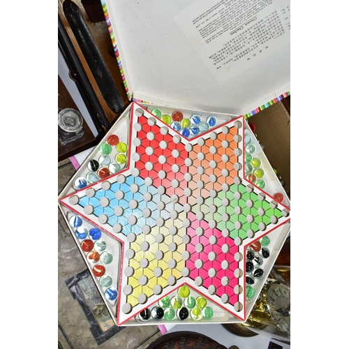 410 - A BOXED CHINESE CHECKERS SET, together with a box of glass marbles