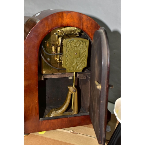 417 - A JUNGHANS MAHOGANY MANTLE CLOCK, runs briefly, chimes ok, with key and pendulum, together with a bo... 