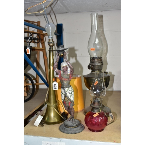 508 - A GROUP OF FOUR LAMPS, comprising a brass oil lamp, height 56cm to top of glass chimney (no shade), ... 