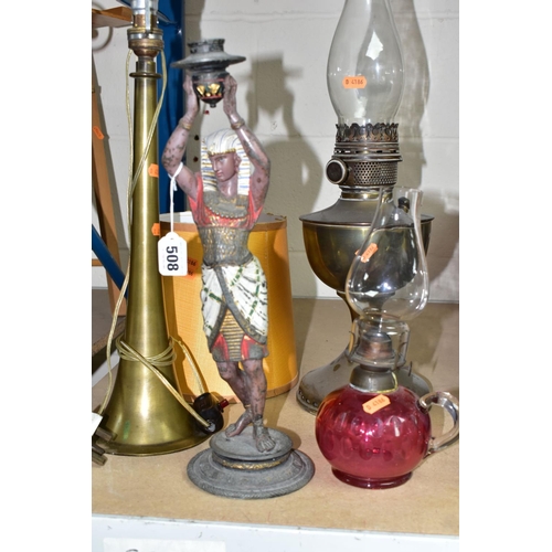 508 - A GROUP OF FOUR LAMPS, comprising a brass oil lamp, height 56cm to top of glass chimney (no shade), ... 