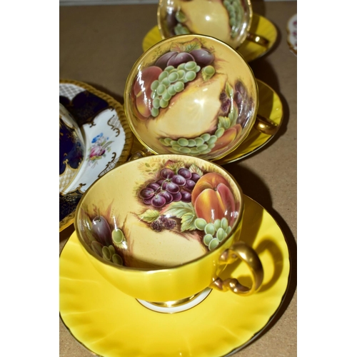 516 - A GROUP OF AYNSLEY 'ORCHARD GOLD' YELLOW CUPS AND COALPORT TEAWARES comprising  Aynsley 'Orchard Gol... 