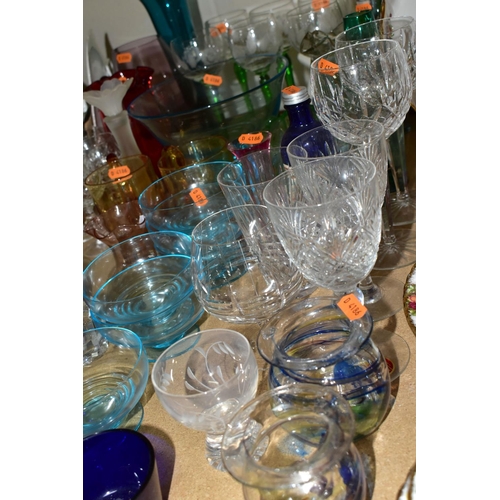 525 - A GROUP OF COLOURED GLASSWARE comprising a set of six German style green stemmed wine glasses with a... 