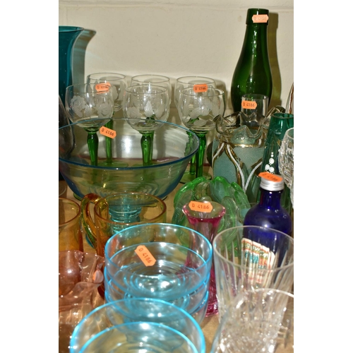 525 - A GROUP OF COLOURED GLASSWARE comprising a set of six German style green stemmed wine glasses with a... 