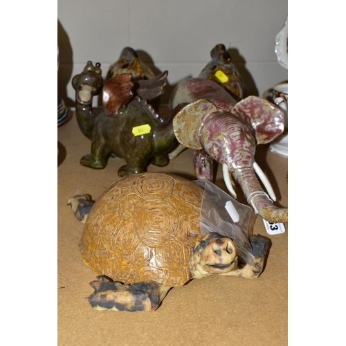 553 - FIVE AMATEUR STUDIO POTTERY ANIMALS, comprising a tortoise, elephant, dragon and two fish with apert... 