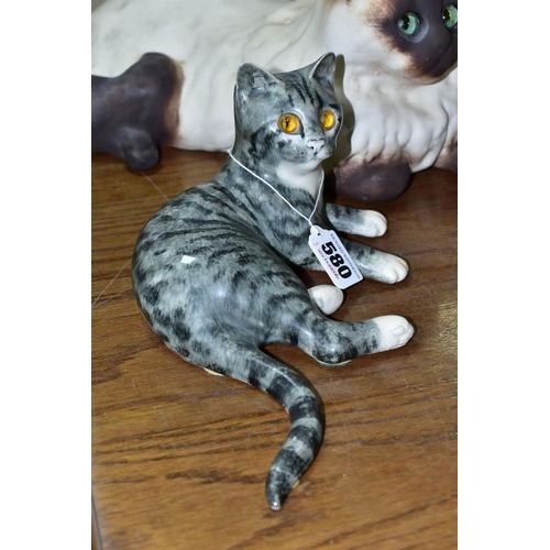 580 - TWO MIKE HINTON CATS comprising a porcelain grey tabby cat with yellow glass eyes, signed on base No... 