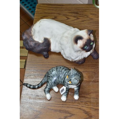 580 - TWO MIKE HINTON CATS comprising a porcelain grey tabby cat with yellow glass eyes, signed on base No... 