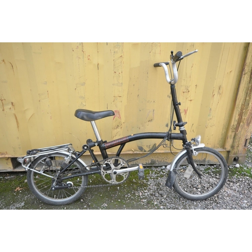 1121 - A BROMPTON THREE SPEED FOLDING BICYCLE in black colour some surface scratches and rust spots (all wo... 