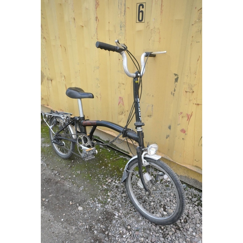 1121 - A BROMPTON THREE SPEED FOLDING BICYCLE in black colour some surface scratches and rust spots (all wo... 