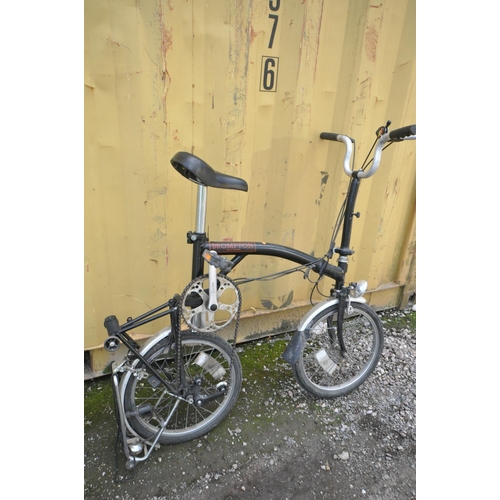 1121 - A BROMPTON THREE SPEED FOLDING BICYCLE in black colour some surface scratches and rust spots (all wo... 