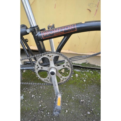 1121 - A BROMPTON THREE SPEED FOLDING BICYCLE in black colour some surface scratches and rust spots (all wo... 