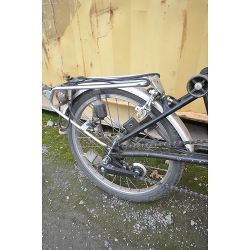 1121 - A BROMPTON THREE SPEED FOLDING BICYCLE in black colour some surface scratches and rust spots (all wo... 