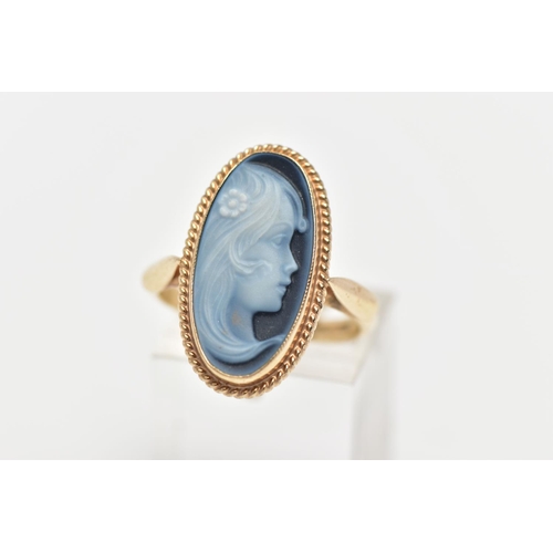 1 - A 9CT GOLD CAMEO RING, oval hardstone form, depicting a lady in profile, collet set within a fine ro... 