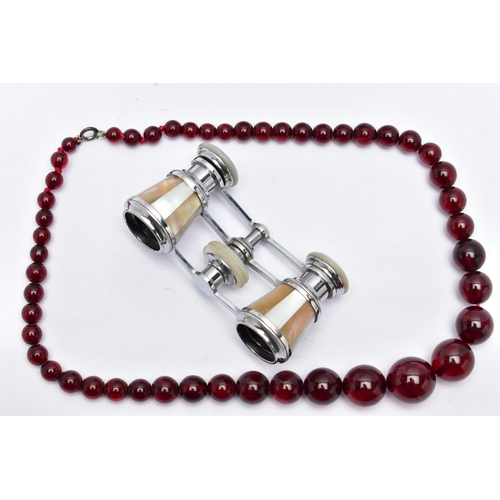 20 - A PAIR OF MOTHER OF PEARL OPERA GLASSES AND A BEADED NECKLACE, the white metal and mother of pearl o... 