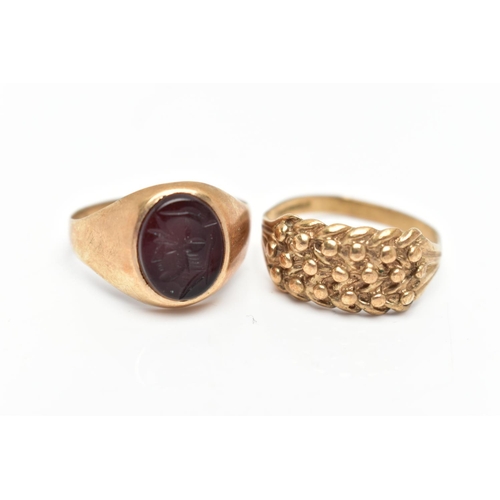 27 - TWO 9CT GOLD RINGS, to include an onyx intaglio signet ring, hallmarked London 1989, ring size T 1/2... 
