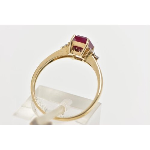33 - A YELLOW METAL GEM SET RING, designed with a central four claw set, rectangular cut synthetic ruby, ... 