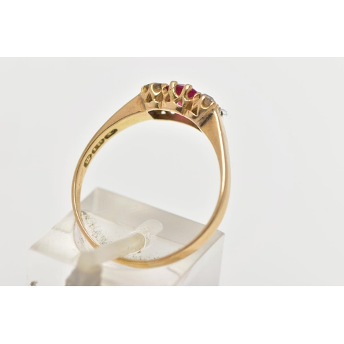 34 - A YELLOW METAL GEM SET RING, centring on a rectangular cut synthetic ruby, flanked with three old cu... 