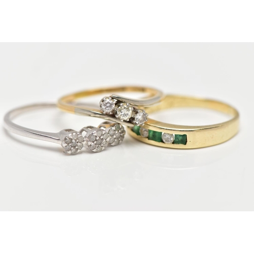 4 - THREE GEM SET RINGS, the first a yellow metal half eternity ring set with four square cut emeralds a... 