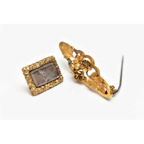 48 - A YELLOW METAL VICTORIAN BROOCH AND A MEMORIAL BROOCH, the first of an openwork floral design, stamp... 