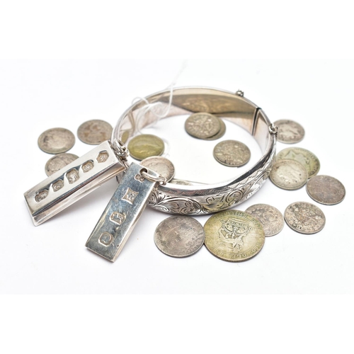 55 - A SELECTION OF SILVER JEWELLERY AND COINS, to include a silver hinged bangle, of engraved foliate de... 