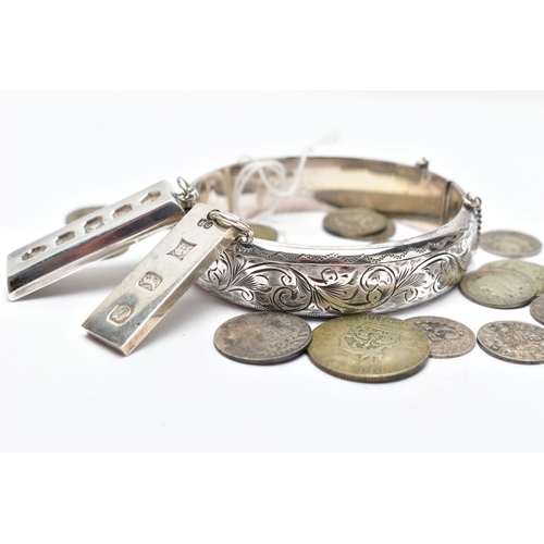 55 - A SELECTION OF SILVER JEWELLERY AND COINS, to include a silver hinged bangle, of engraved foliate de... 