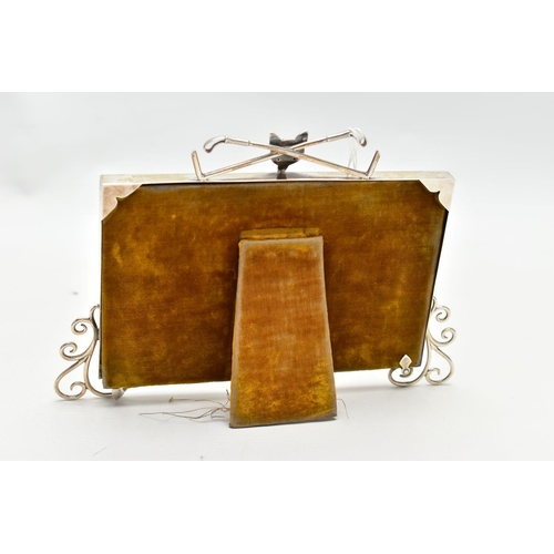 58 - AN EARLY 20TH CENTURY SILVER PHOTOFRAME, polished frame detailed with scroll work to the bottom corn... 