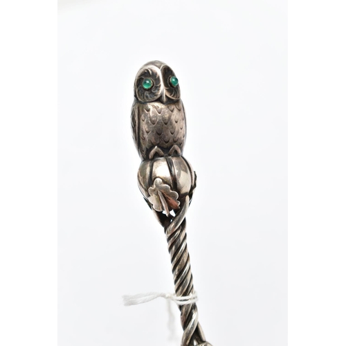 59 - A 'GEORG JENSEN' SILVER CAKE SLICE, twisted handle with floral detailing, displaying an owl to the t... 
