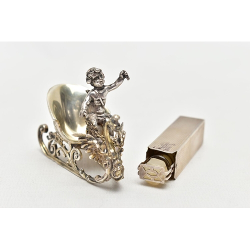 67 - A SILVER TRAVEL PERFUME CASE AND A WHITE METAL FIGURINE, engine turned pattern to the rectangular pe... 