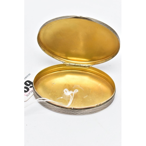 69 - A WHITE METAL HINGED TRINKET BOX, of an oval form, depicting seagulls on rocks to the cover, engine ... 