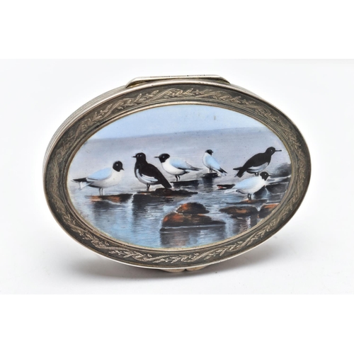 69 - A WHITE METAL HINGED TRINKET BOX, of an oval form, depicting seagulls on rocks to the cover, engine ... 