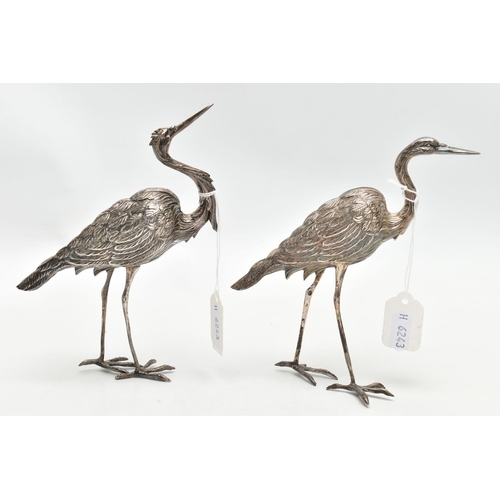 75 - A PAIR OF WHITE METAL CRANE FIGURINES, realistically textured, approximate height 175mm, rubbed stam... 