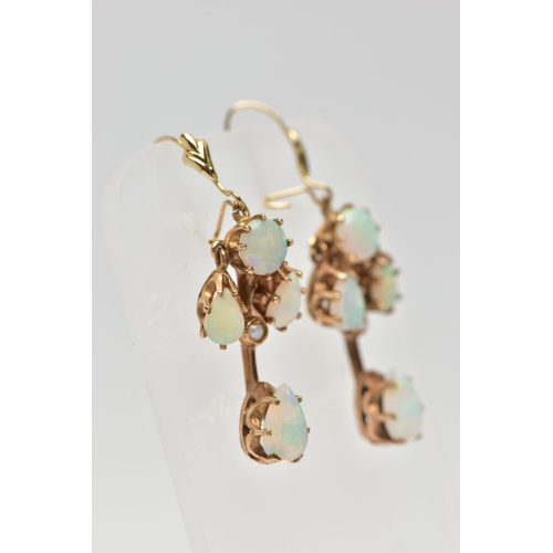 8 - A 9CT GOLD OPAL RING AND A PAIR OF OPAL DROP EARRINGS, the ring designed with three graduated oval o... 