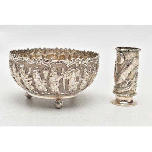 83 - AN EMBOSSED WHITE METAL BOWL AND SMALL VASE, the round bowl decorated with embossed multiple figural... 