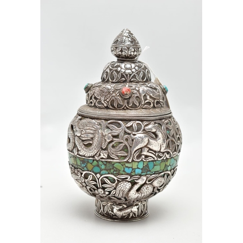 87 - A WHITE METAL DECORATIVE VASE, detailed with tigers, lions, dragons and other animals within a flora... 