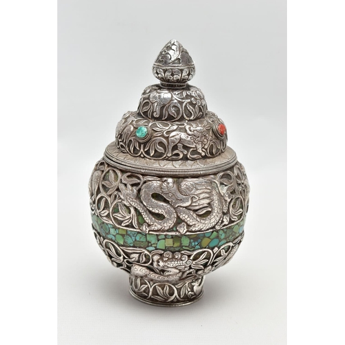 87 - A WHITE METAL DECORATIVE VASE, detailed with tigers, lions, dragons and other animals within a flora... 