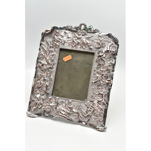 89 - A PAIR OF WHITE METAL PHOTO FRAMES, rectangular form, detailed with a number of cherubs, a woman and... 