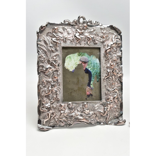 89 - A PAIR OF WHITE METAL PHOTO FRAMES, rectangular form, detailed with a number of cherubs, a woman and... 