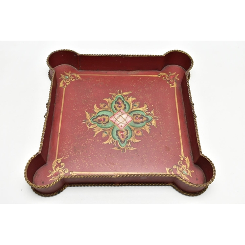 927A - A 20TH CENTURY TWIN HANDLED PAINTED METAL TRAY OF SHAPED SQUARE FORM, gilt rope twist handles and ri... 