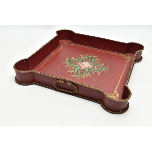 927A - A 20TH CENTURY TWIN HANDLED PAINTED METAL TRAY OF SHAPED SQUARE FORM, gilt rope twist handles and ri... 