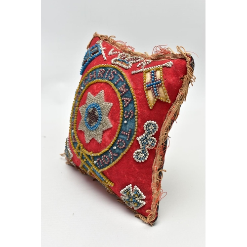 931A - A LATE VICTORIAN VELVET BEADWORK PIN CUSHION OF SQUARE FORM WITH ORDER OF THE GARTER TO THE CENTRE, ... 