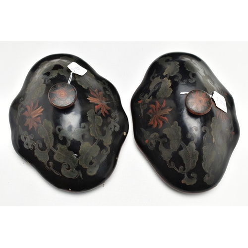 999A - A PAIR OF ORIENTAL BLACK LACQUERED PAPIER MACHE TEA CANNISTERS AND COVERS OF SHAPED OVAL FORM, the d... 