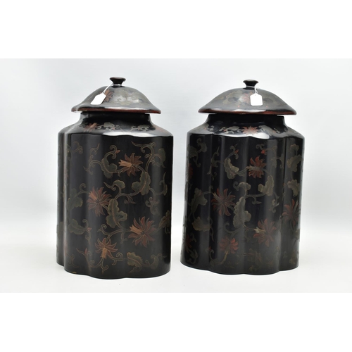 999A - A PAIR OF ORIENTAL BLACK LACQUERED PAPIER MACHE TEA CANNISTERS AND COVERS OF SHAPED OVAL FORM, the d... 