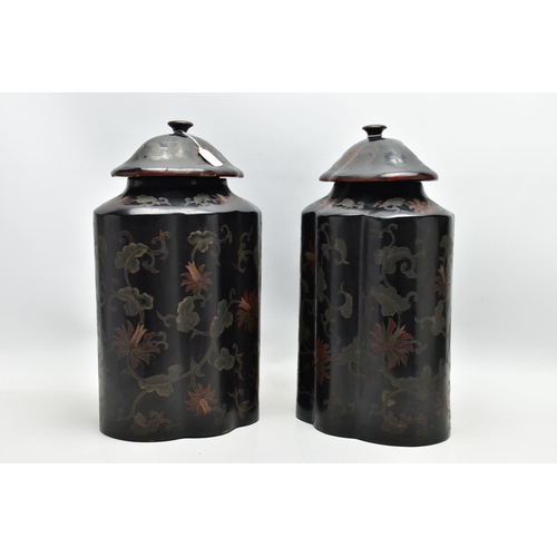 999A - A PAIR OF ORIENTAL BLACK LACQUERED PAPIER MACHE TEA CANNISTERS AND COVERS OF SHAPED OVAL FORM, the d... 