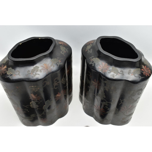 999A - A PAIR OF ORIENTAL BLACK LACQUERED PAPIER MACHE TEA CANNISTERS AND COVERS OF SHAPED OVAL FORM, the d... 