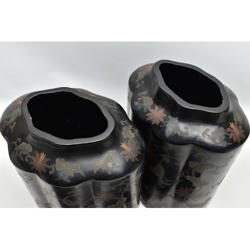 999A - A PAIR OF ORIENTAL BLACK LACQUERED PAPIER MACHE TEA CANNISTERS AND COVERS OF SHAPED OVAL FORM, the d... 